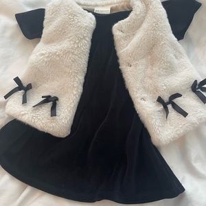 black velvet dress and white faux fur vest